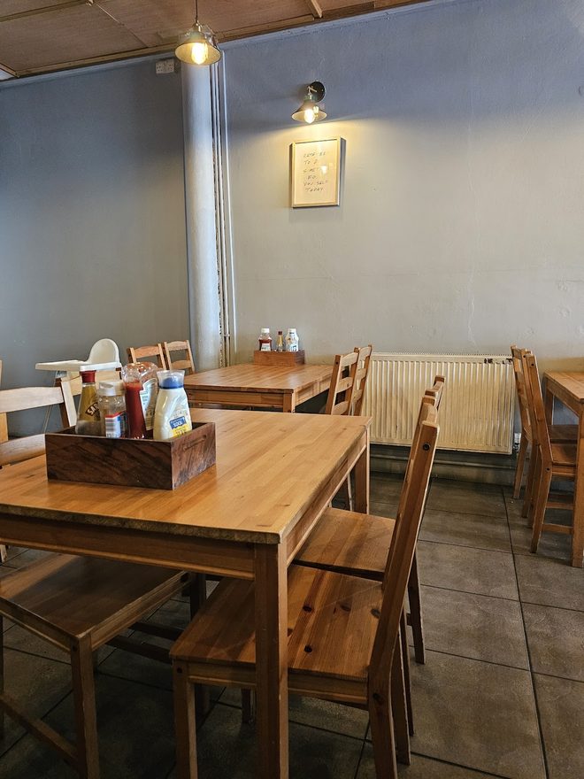 Wooden tables and chairs in a quiet corner of the dining room